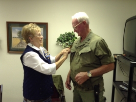 Peggy Vanyo presented Bill his Vietnam Veteran lapel pin.